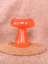 Mushroom shaped cup with red drink